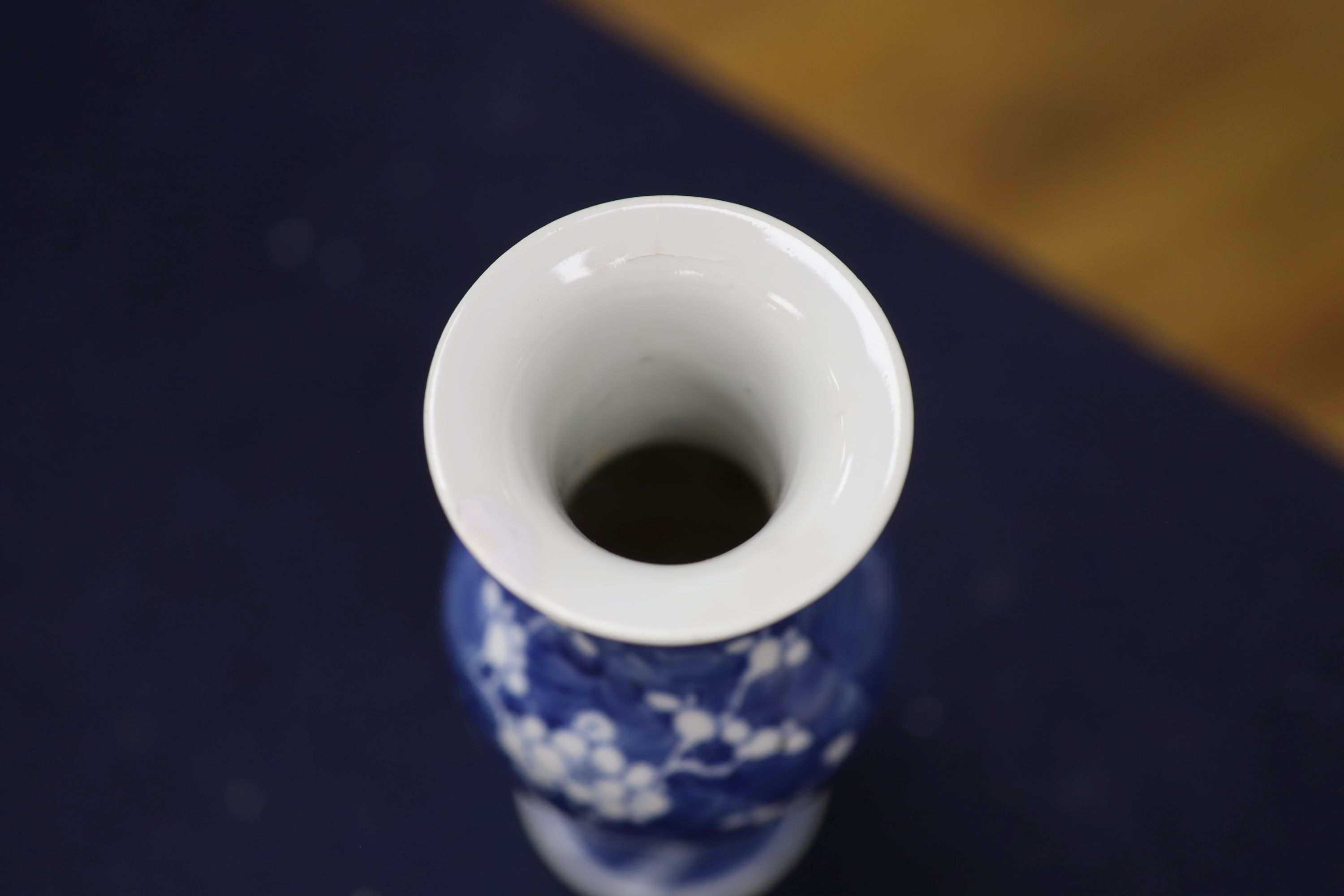 Two Chinese blue and white vases and a dish, together with a famille rose dish, tallest 28cm